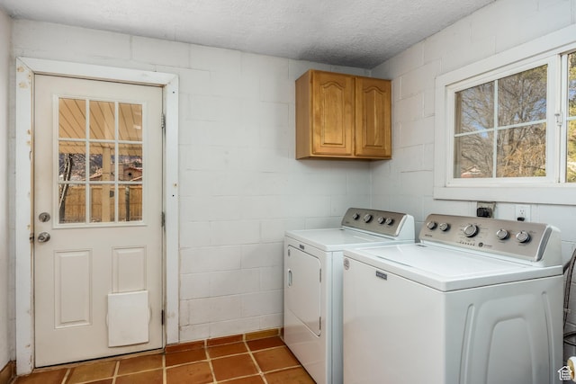 311 N 300 W, Kanab, UT 84741 - washroom with cabinet space, concrete block wall, and washing machine and clothes dryer