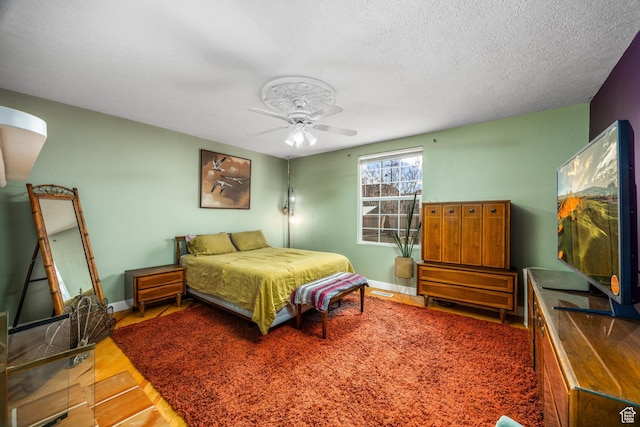 311 N 300 W, Kanab, UT 84741 - bedroom with wood finished floors, a ceiling fan, and baseboards