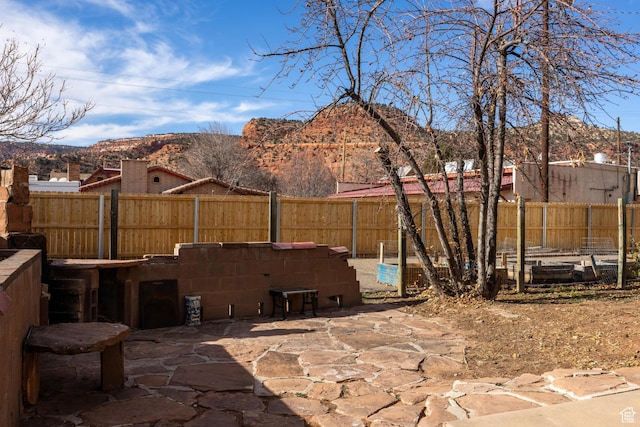 311 N 300 W, Kanab, UT 84741 - view of patio with a fenced backyard and a mountain view