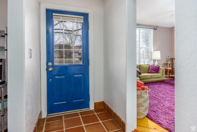 311 N 300 W, Kanab, UT 84741 - entryway featuring baseboards, a textured wall, and tile patterned flooring