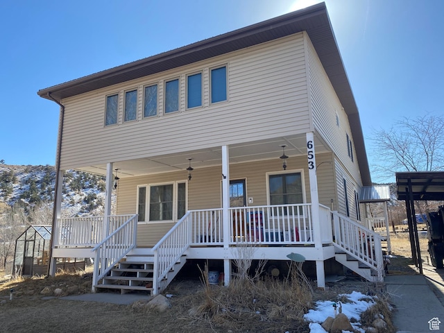 view of front of home with a porch and stairs