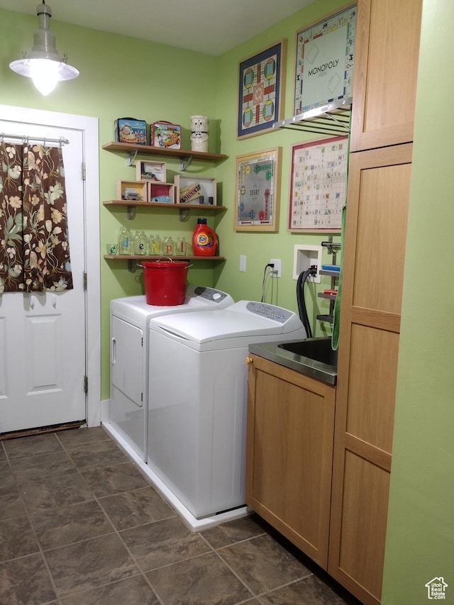 laundry room featuring separate washer and dryer and cabinet space