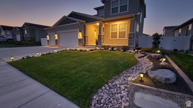 1395 E Kelsey Dr, Eagle Mountain, UT 84005 - craftsman inspired home featuring stone siding, fence, an attached garage, a front yard, and driveway