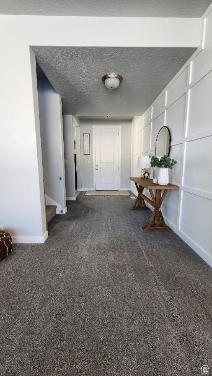 1395 E Kelsey Dr, Eagle Mountain, UT 84005 - hallway with baseboards, carpet floors, and a textured ceiling