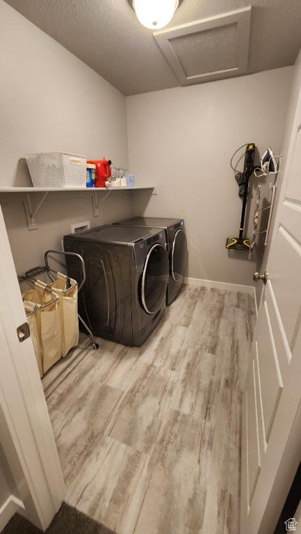 1395 E Kelsey Dr, Eagle Mountain, UT 84005 - washroom with attic access, wood finished floors, washing machine and clothes dryer, laundry area, and baseboards