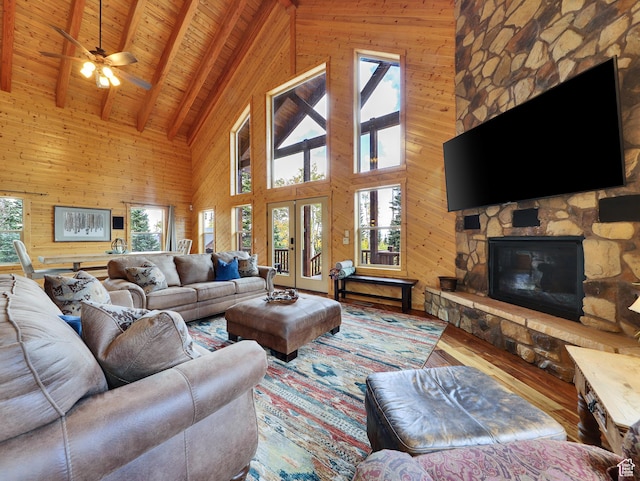 161 N Irish Trl, Brian Head, UT 84719 - living room with lofted ceiling with beams, wood finished floors, wood walls, a fireplace, and wood ceiling