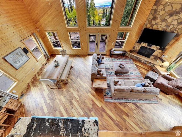 161 N Irish Trl, Brian Head, UT 84719 - living room featuring wooden walls, french doors, wood-type flooring, and high vaulted ceiling