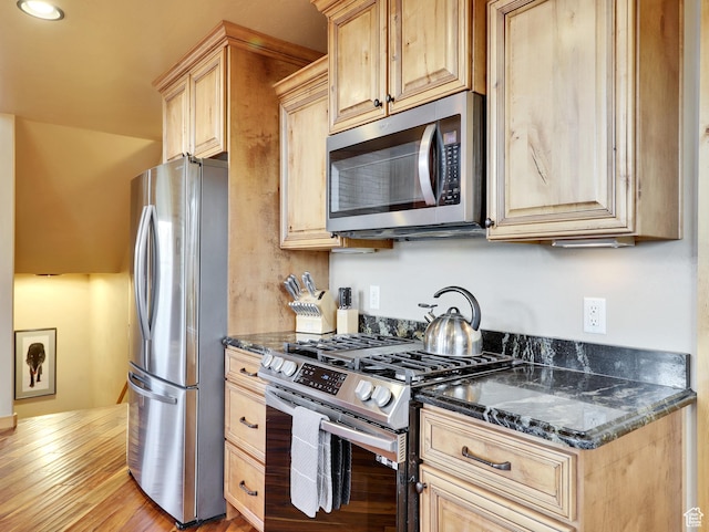 161 N Irish Trl, Brian Head, UT 84719 - kitchen with light brown cabinetry, appliances with stainless steel finishes, and dark stone counters