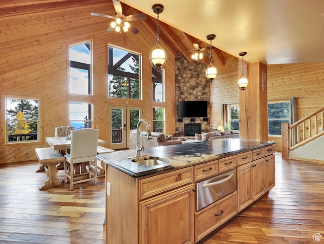 161 N Irish Trl, Brian Head, UT 84719 - kitchen with wooden walls, high vaulted ceiling, a sink, light wood-style floors, and a warming drawer