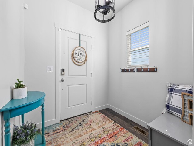 6119 N White Rock Rd, Eagle Mountain, UT 84005 - entryway featuring dark wood finished floors, visible vents, and baseboards