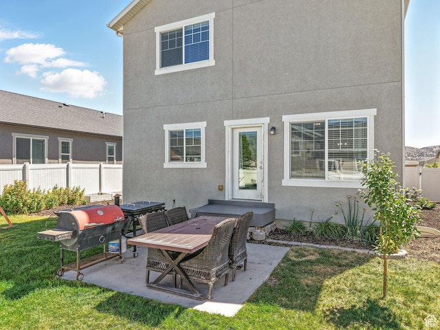6119 N White Rock Rd, Eagle Mountain, UT 84005 - back of house with a patio and stucco siding