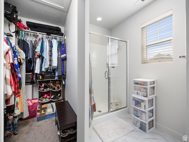 6119 N White Rock Rd, Eagle Mountain, UT 84005 - full bath featuring visible vents, baseboards, a stall shower, a spacious closet, and marble finish floor