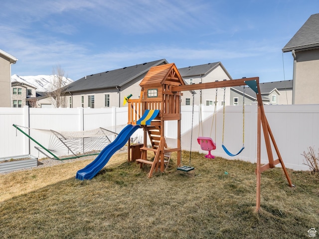 6119 N White Rock Rd, Eagle Mountain, UT 84005 - view of playground with a yard, a fenced backyard, and a residential view
