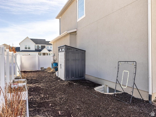 6119 N White Rock Rd, Eagle Mountain, UT 84005 - view of yard with a storage unit, a fenced backyard, and an outdoor structure
