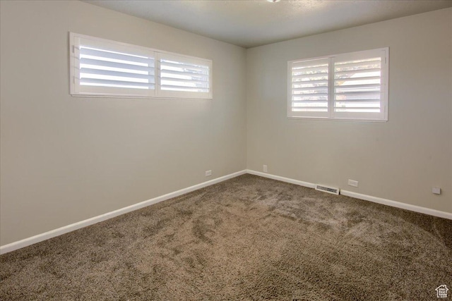 454 E 3100 N, North Ogden, UT 84414 - empty room with visible vents, a healthy amount of sunlight, baseboards, and carpet floors