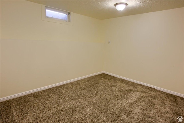 454 E 3100 N, North Ogden, UT 84414 - below grade area featuring carpet flooring, a textured ceiling, and baseboards