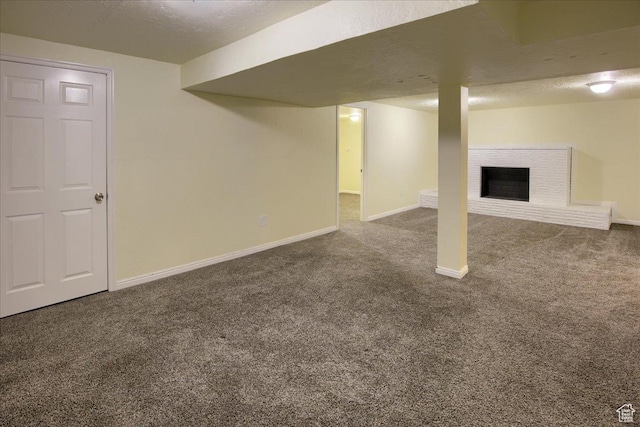 454 E 3100 N, North Ogden, UT 84414 - finished below grade area with a brick fireplace, a textured ceiling, baseboards, and carpet floors
