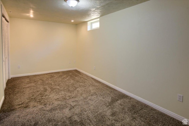 454 E 3100 N, North Ogden, UT 84414 - below grade area featuring baseboards, carpet floors, and a textured ceiling