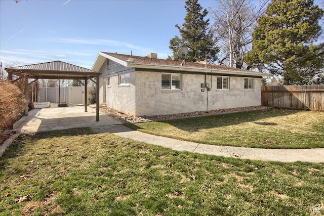 454 E 3100 N, North Ogden, UT 84414 - back of house featuring a patio, a fenced backyard, a gazebo, a lawn, and brick siding