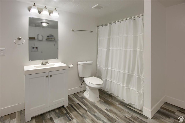 454 E 3100 N, North Ogden, UT 84414 - full bathroom with toilet, wood finished floors, a shower with shower curtain, baseboards, and vanity