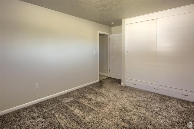 454 E 3100 N, North Ogden, UT 84414 - unfurnished bedroom featuring a closet, baseboards, carpet, and a textured ceiling