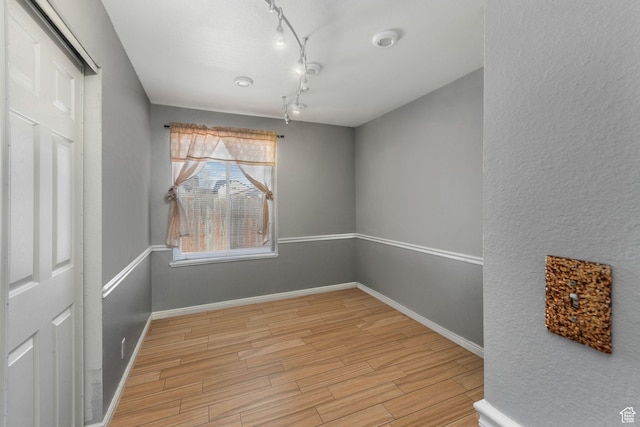4201 S 2260 W, Taylorsville, UT 84129 - unfurnished room with light wood-type flooring, baseboards, and rail lighting