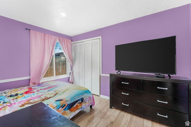 4201 S 2260 W, Taylorsville, UT 84129 - bedroom with light wood-type flooring, baseboards, and a closet