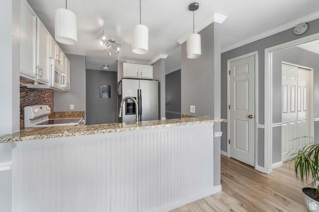 4201 S 2260 W, Taylorsville, UT 84129 - kitchen featuring white appliances, a peninsula, crown molding, light wood finished floors, and light stone countertops