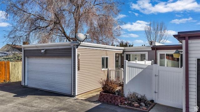 4201 S 2260 W, Taylorsville, UT 84129 - view of front of house with a gate, fence, and driveway