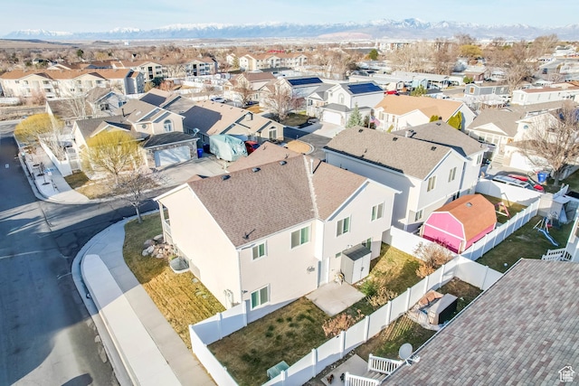 birds eye view of property featuring a mountain view and a residential view
