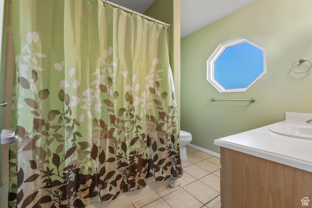 bathroom featuring tile patterned floors, toilet, a shower with shower curtain, and vanity