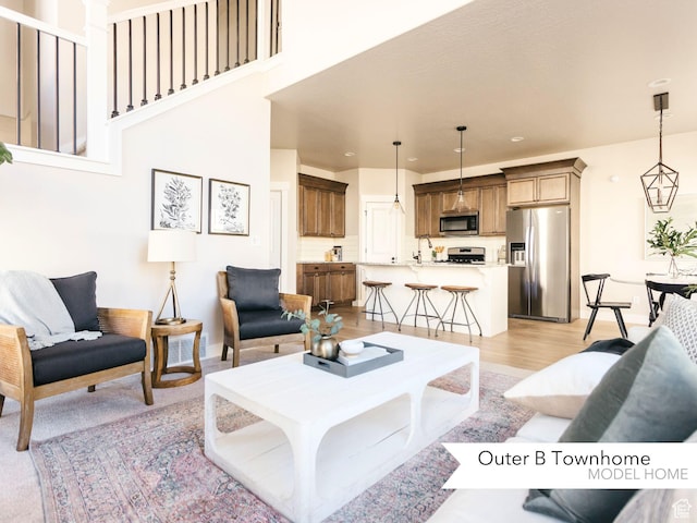 living area featuring recessed lighting and light wood-style floors
