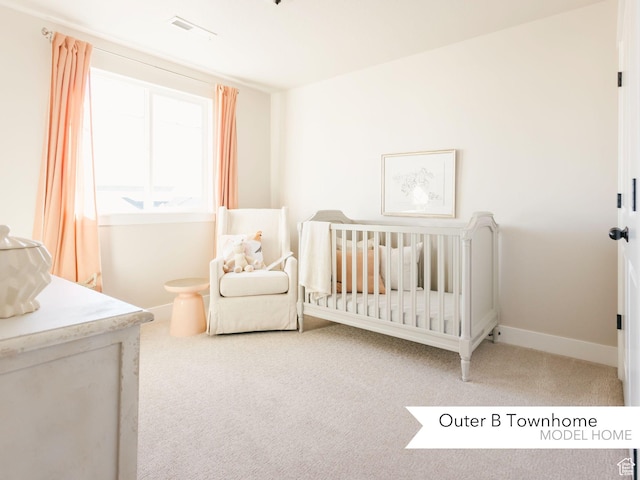 bedroom featuring baseboards, carpet flooring, a nursery area, and visible vents