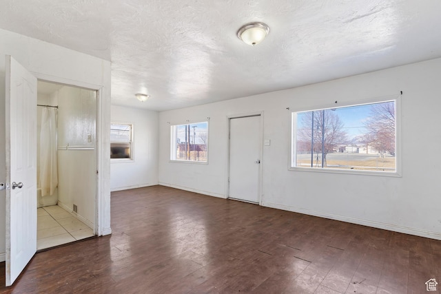 171 17th St, Ogden, UT 84404 - foyer entrance featuring wood finished floors, baseboards, and a textured ceiling