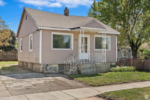 171 17th St, Ogden, UT 84404 - bungalow-style home with a shingled roof and a chimney
