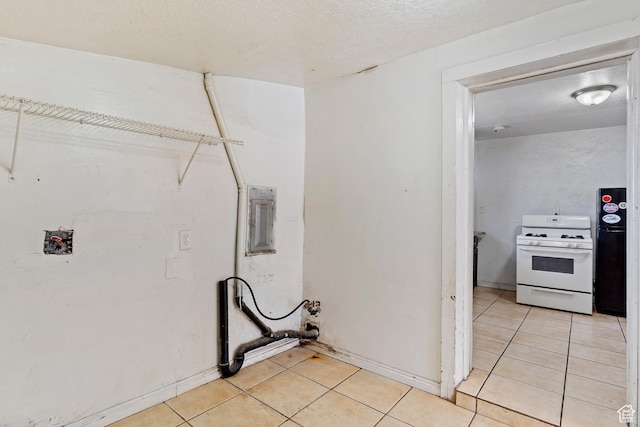 171 17th St, Ogden, UT 84404 - laundry room with light tile patterned floors and baseboards