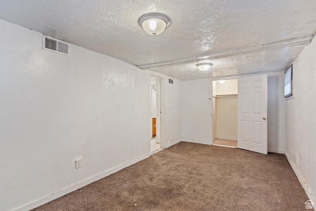 171 17th St, Ogden, UT 84404 - finished below grade area featuring carpet floors, baseboards, and a textured ceiling