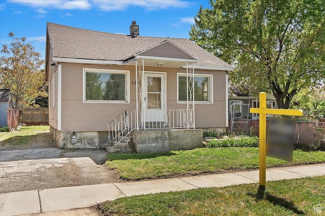 171 17th St, Ogden, UT 84404 - bungalow-style house with a shingled roof and a chimney