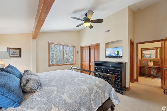 bedroom with visible vents, light carpet, beam ceiling, a ceiling fan, and a closet