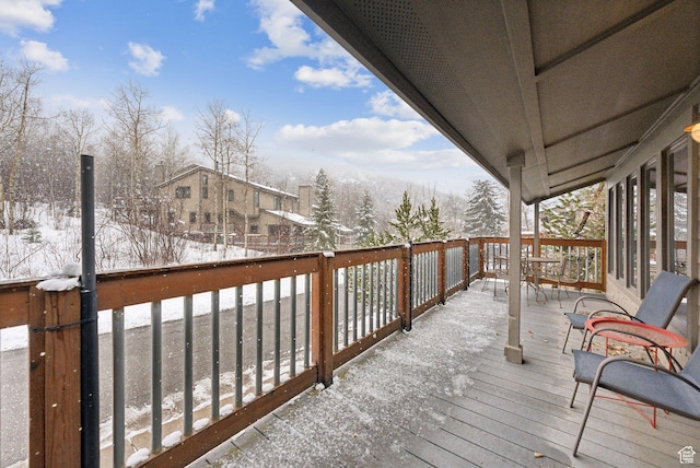 view of snow covered deck