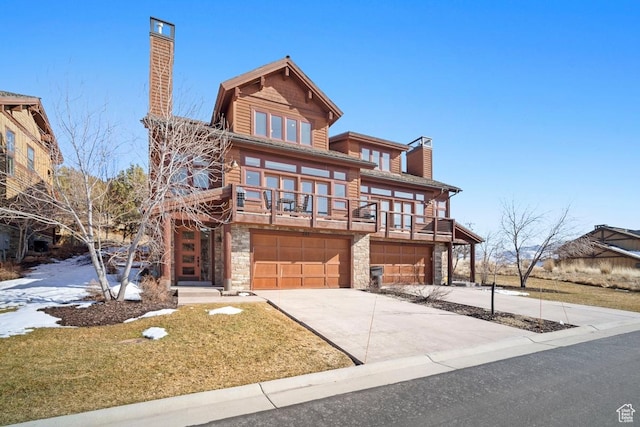 292 N Abajo Peak Way, Heber City, UT 84032 - view of front of home featuring a chimney, stone siding, a garage, driveway, and a front yard