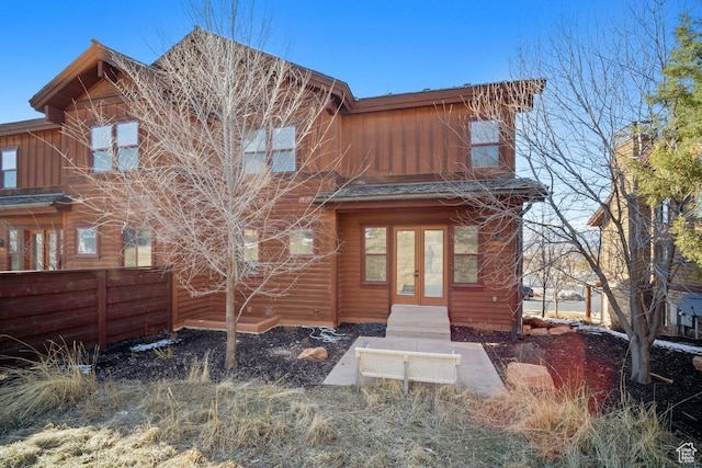292 N Abajo Peak Way, Heber City, UT 84032 - view of front facade featuring french doors, fence, and board and batten siding
