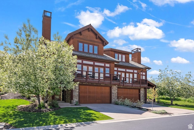 292 N Abajo Peak Way, Heber City, UT 84032 - view of front of house with a chimney, stone siding, a garage, driveway, and a front yard