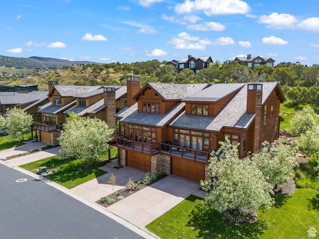 292 N Abajo Peak Way, Heber City, UT 84032 - view of front of property featuring a chimney, an attached garage, stone siding, and french doors