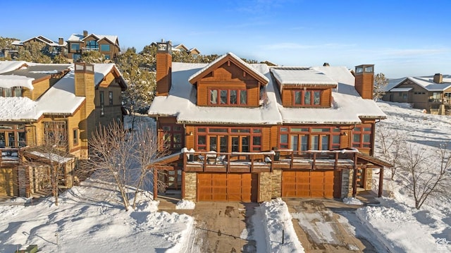 292 N Abajo Peak Way, Heber City, UT 84032 - view of front of home featuring a chimney, an attached garage, a residential view, and stone siding