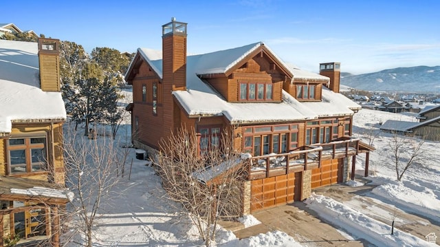 292 N Abajo Peak Way, Heber City, UT 84032 - snow covered property with a chimney, an attached garage, and concrete driveway