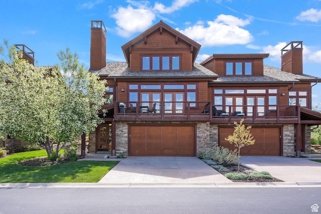 292 N Abajo Peak Way, Heber City, UT 84032 - view of front of home with a chimney, a garage, stone siding, and concrete driveway