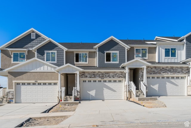 606 W 4500 S Unit 327, Mapleton, UT 84664 - townhome / multi-family property with an attached garage, concrete driveway, board and batten siding, and stone siding