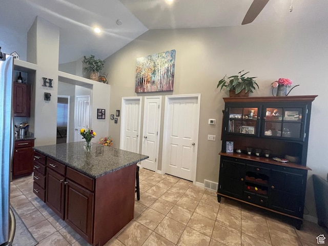 225 W Lyman Ln, Bountiful, UT 84010 - kitchen with visible vents, high vaulted ceiling, a ceiling fan, a kitchen breakfast bar, and a kitchen island
