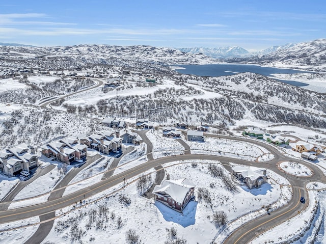 10740 N Hideout Trl, Hideout, UT 84036 - snowy aerial view featuring a mountain view and a residential view
